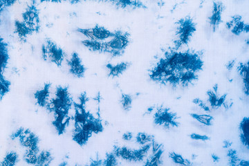 Dyed indigo fabric background and textured