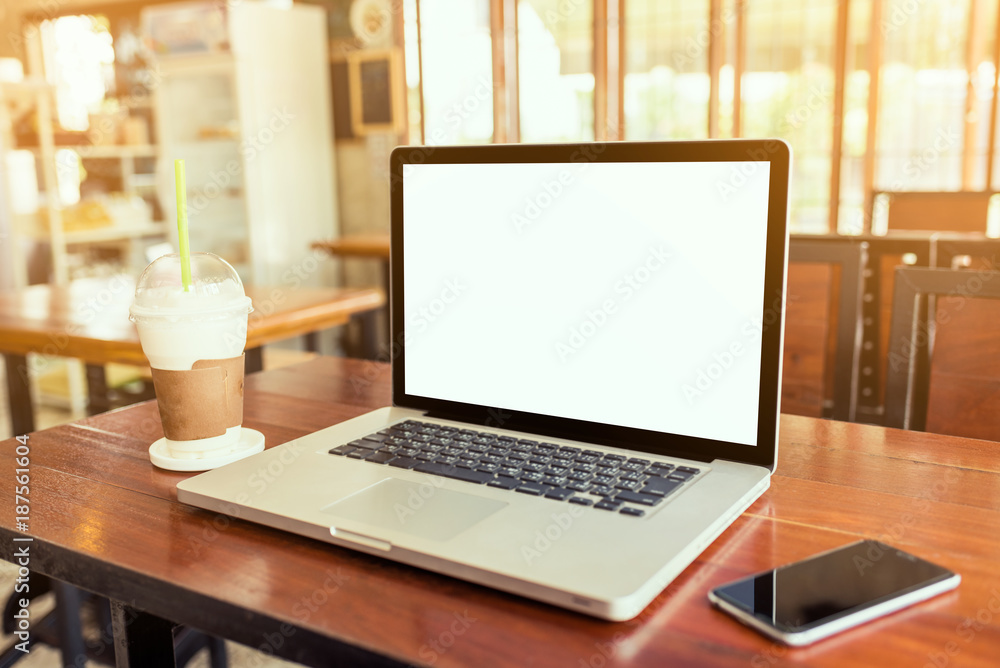 Laptop computer white screen on wood table Laptop computer white screen on wood table