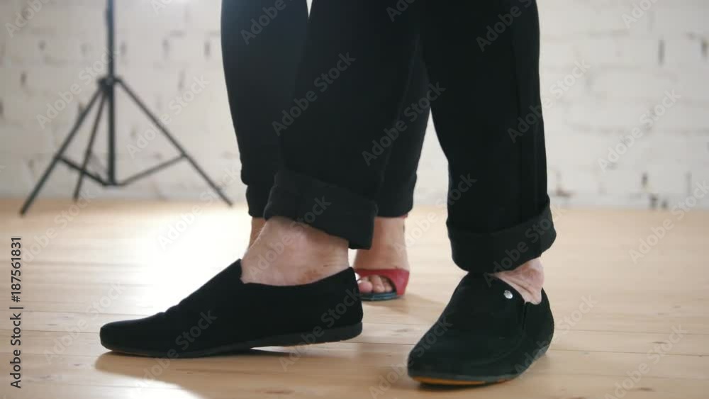 Couples dancing salsa or kizomba in studio - legs, close up Couples dancing salsa or kizomba in studio - legs, close up