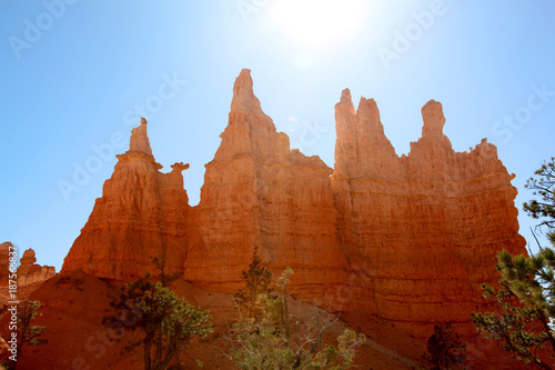 Bryce Canyon hoodoos silhouetted against a bright blue sky