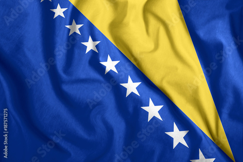 Quadro su tela Bosnia and Herzegovina flag fluttering in the wind