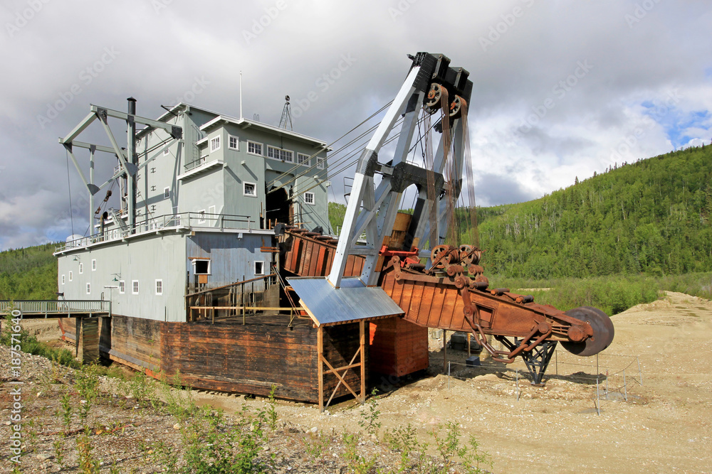 The remains of a historical delelict gold dredge on Bonanza creek near Dawson City, Yukon, Canada