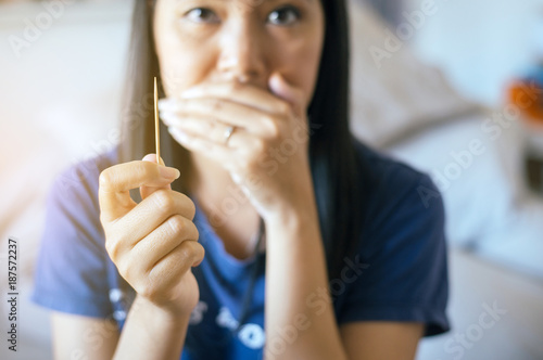 Close up of woman using toothpick photo
