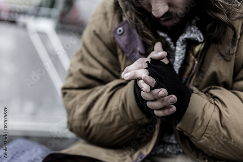Close-up of dirty beggar's hands photo