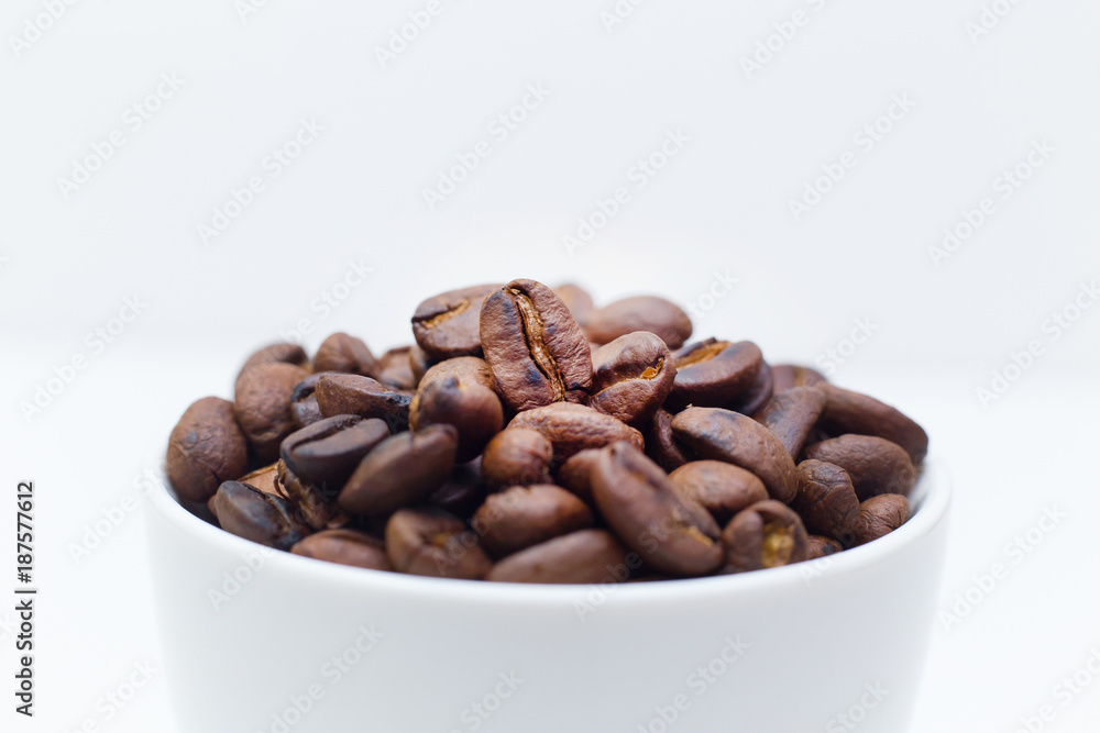 roasted coffee beans on white background space modern style. roasted coffee beans on white background space modern style.