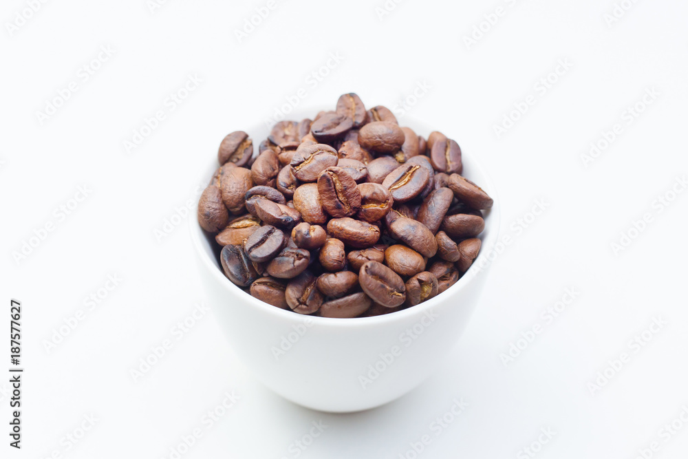 roasted coffee beans on white background space modern style. roasted coffee beans on white background space modern style.
