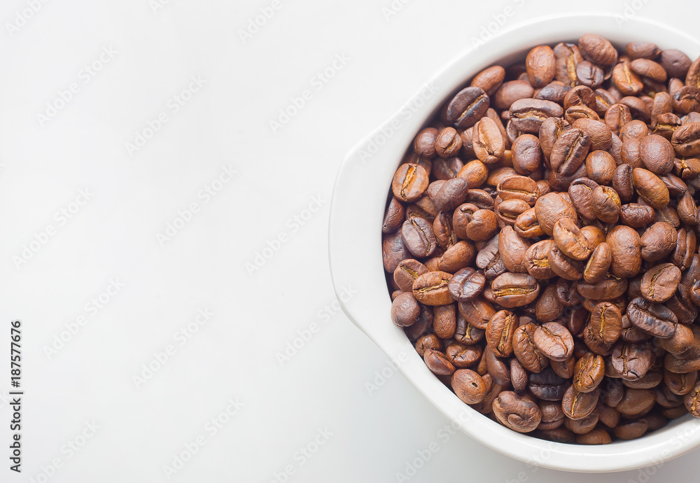 roasted coffee beans on white background space modern style.