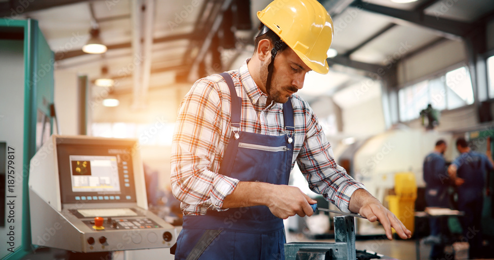Portrait of an handsome engineer in a factory