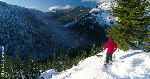 Solo Mountain Man Snowshoe Backcountry Woods Sunny Bright Red Jacket Great Outdoors Trekking Journey