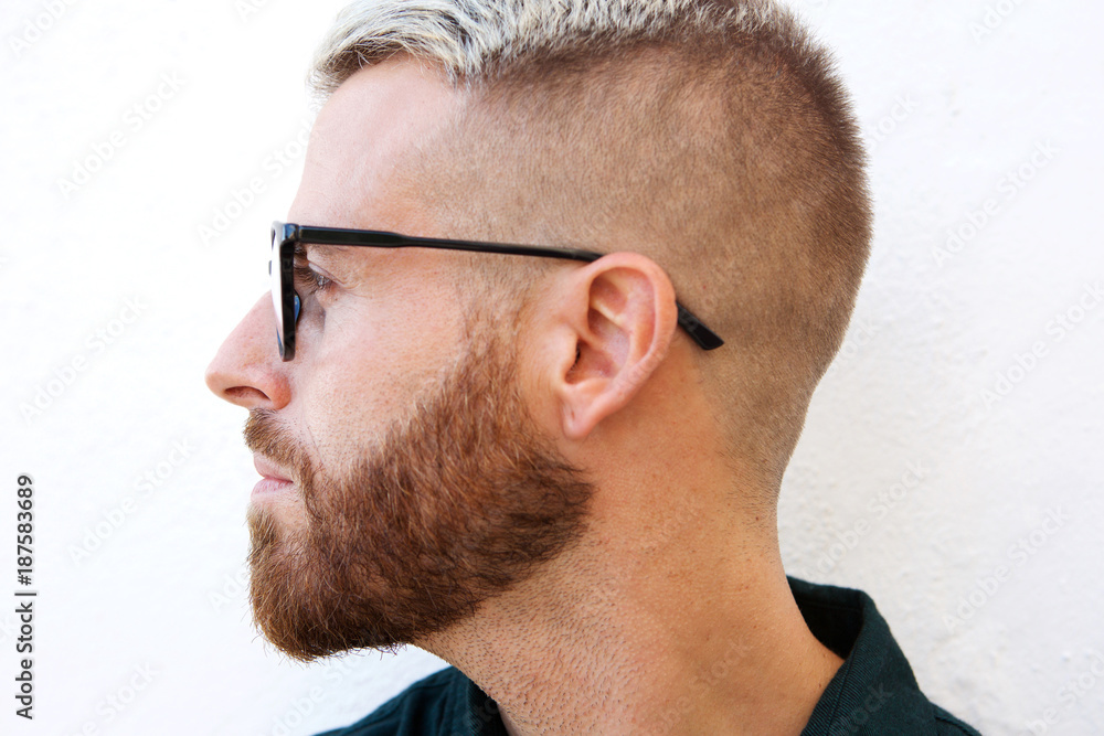 Close up head of man with glasses against isolated white background Close up head of man with glasses against isolated white background