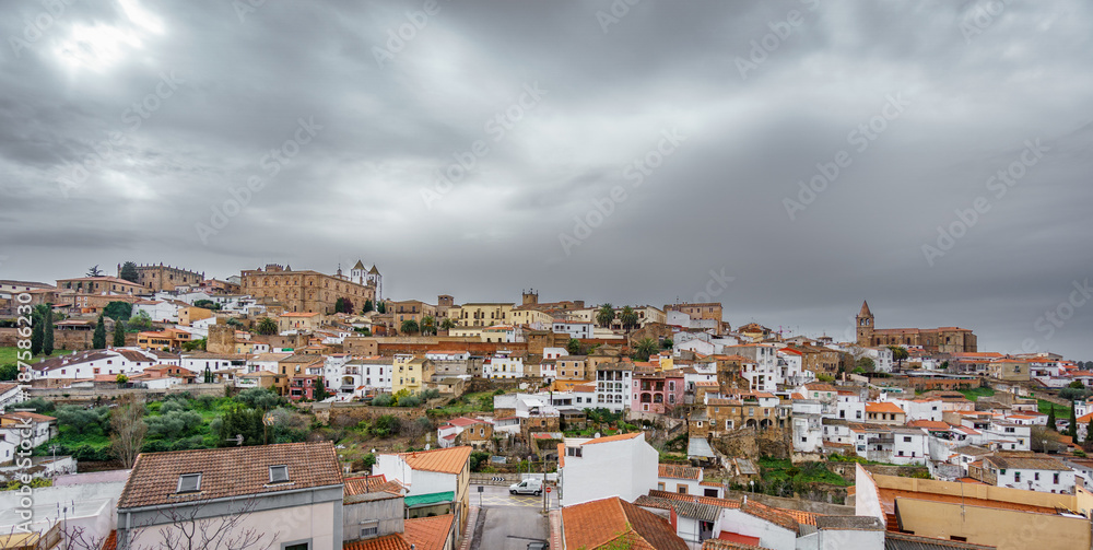 Medieval Caceres with dark cloudy sky