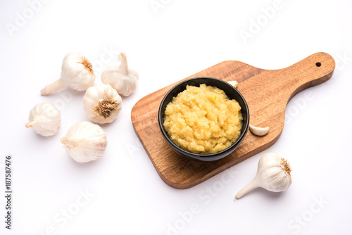 Garlic Paste or Toum or Toumya with raw garlic, isolated over white background 
 photo