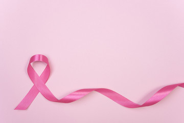 pink ribbon breast cancer on pink background. with copy space