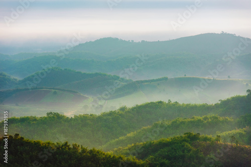Dreamy landscape of mountain hill and rice field in early morning.