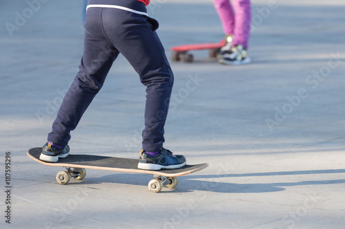 happy children skateboarding on fresh air, healthy lifestyle