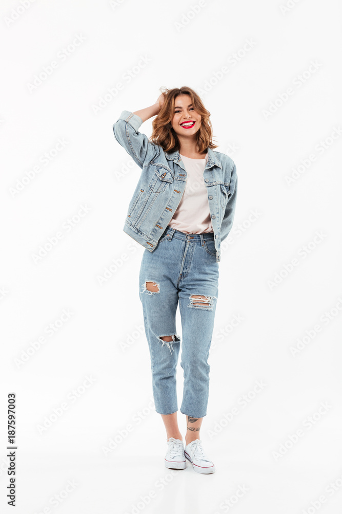 Full length image of Cheerful woman in denim clothes Full length image of Cheerful woman in denim clothes