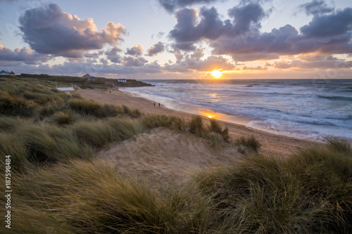 Constantine Bay at sunset looking towards Treyarnon Point on the North Cornwall coast.
