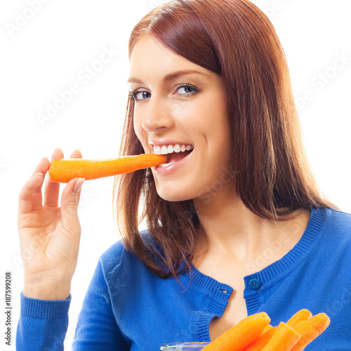 Cheerful woman eating carrots, over white