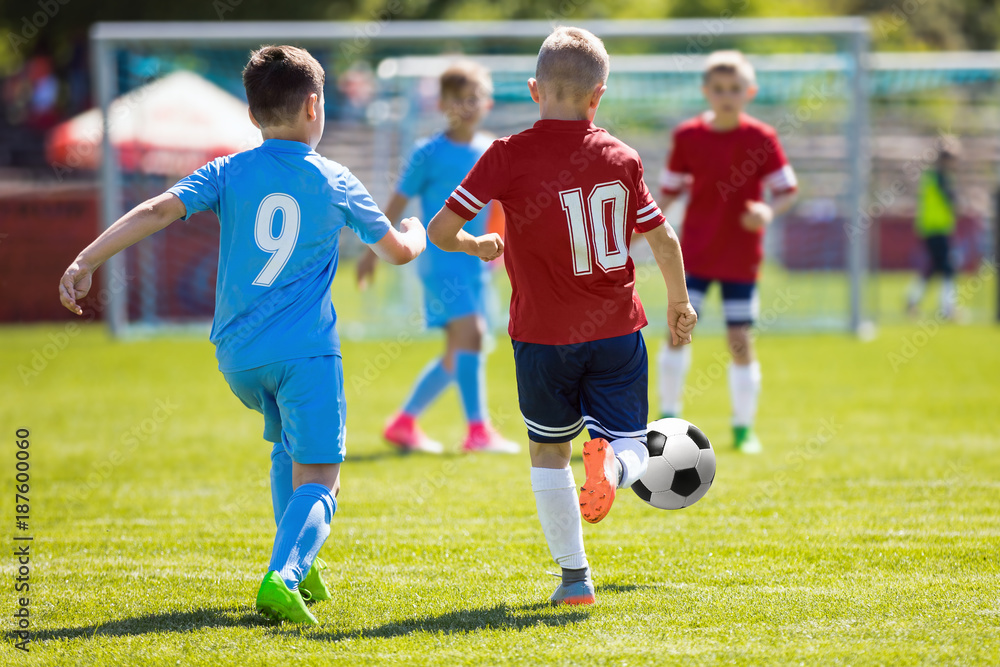 Running Soccer Football Players. Footballers Kicking Football Match. Soccer School Tournament. Young Soccer Players Running After the Ball. Soccer Stadium in the Background Running Soccer Football Players. Footballers Kicking Football Match. Soccer School Tournament. Young Soccer Players Running After the Ball. Soccer Stadium in the Background
