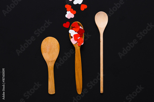 Valentine background, paper hearts and wooden spoons