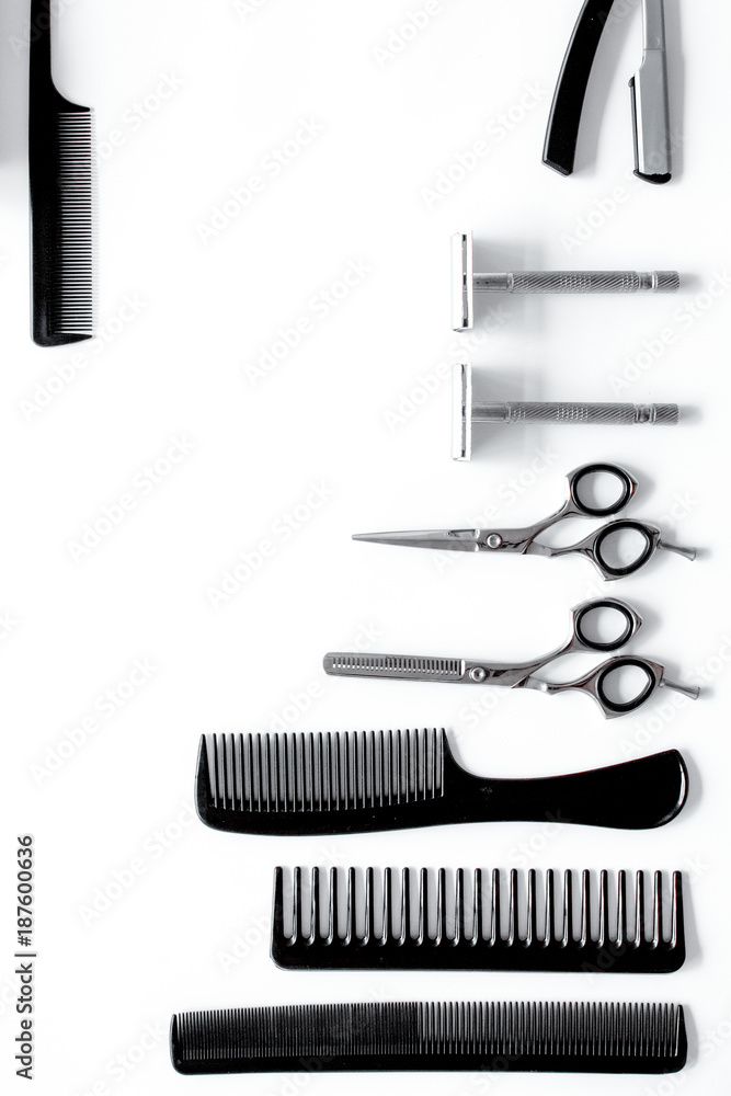 Combs and hairdresser tools in beauty salon on white background 