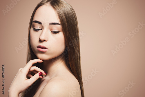 Beauty model on beige background, fashion shooting