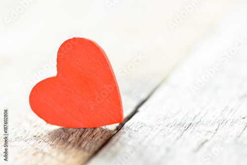 Heart on a wooden background. Background in the style of Valentine's Day. Heart on a wooden background.