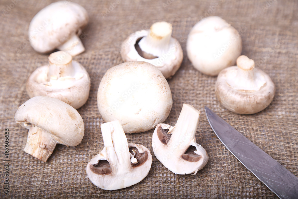 Champignon mushrooms and a knife Champignon mushrooms and a knife