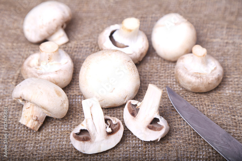 Champignon mushrooms and a knife