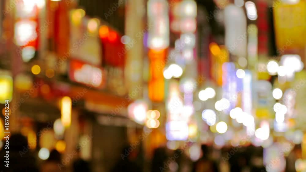 Blurred video of night city, people walking at street with illuminated shopping malls. Japan, Tokyo, Shinjuku district. Blurred video of night city, people walking at street with illuminated shopping malls. Japan, Tokyo, Shinjuku district.
