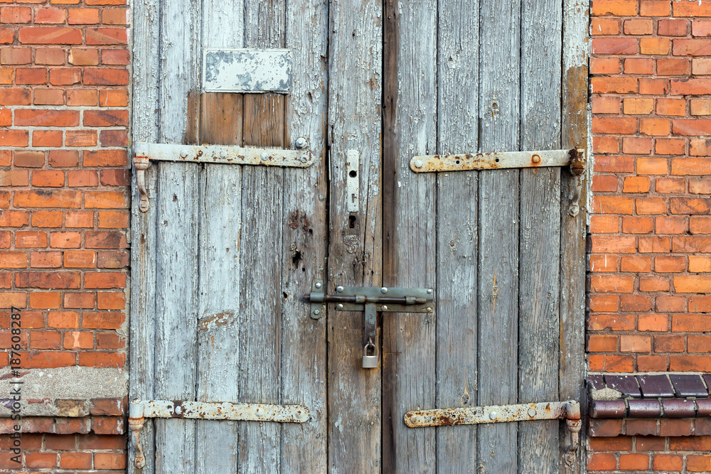 Old wooden door. Grunge background texture for design Old wooden door. Grunge background texture for design