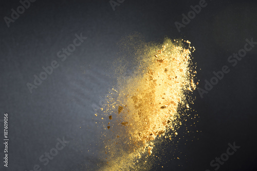 Canvas Print Turmeric spice being thrown into the air