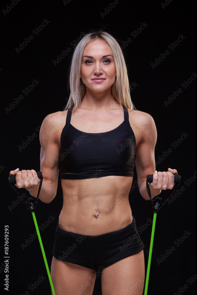 sports woman portrait wearing black sportswear over dark sports woman portrait wearing black sportswear over dark