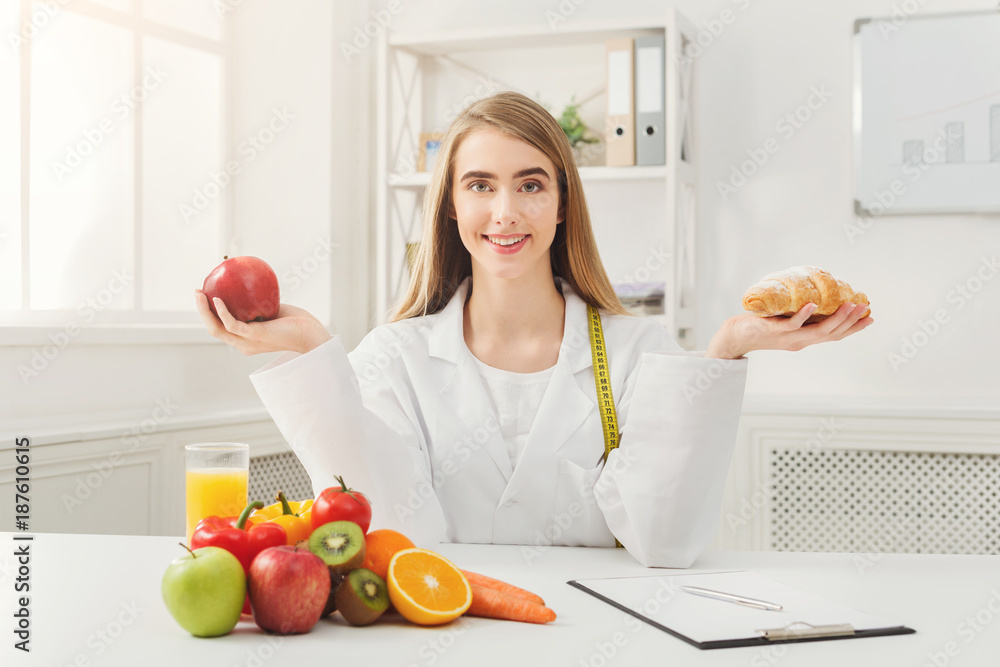 Dietitian nutritionist with bun and apple