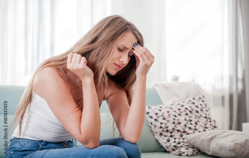 Woman at home suffering from headache, emotions and stress Woman at home suffering from headache, emotions and stress