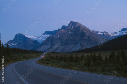 Icefields Parkway after sunset with cars on road in Rocky Mountains, Alberta © Martin Hossa