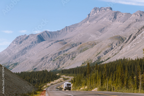 Caravan on scenic Icefields Parkway highway in Rocky Mountains, Alberta, Canada on sunny day © Martin Hossa
