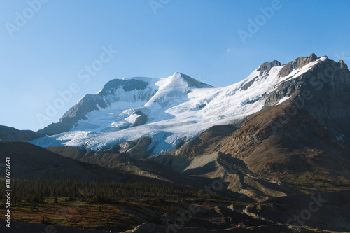 Mountains with glacier lighten by sunrise in Jasper