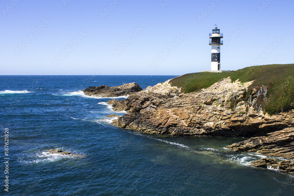 Illa Pancha in Ribadeo, Spain, a beautiful island with two lighthouses guarding the Eo estuary that delimits the border between Galicia and Asturias