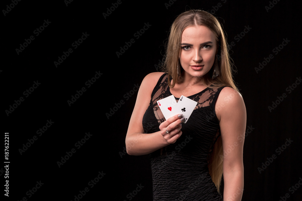 Young beautiful woman playing in casino. Girl holding the winning combination of poker cards. Two aces Young beautiful woman playing in casino. Girl holding the winning combination of poker cards. Two aces