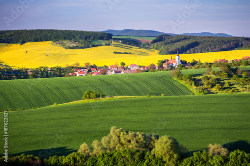 Endless Green Fields, Rolling Hills, Tractor Tracks, Spring Landscape under Blue Sky. South Moravia, Czech Republic