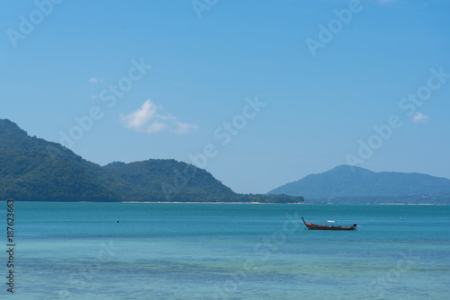 A boat in beautiful sea and blue sky background