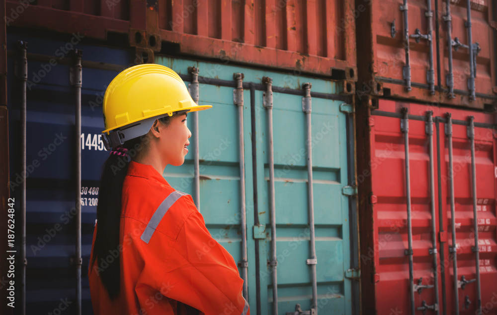 foreman control loading cargo or container in the container yard port international . foreman control loading cargo or container in the container yard port international .