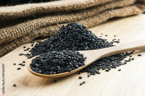 Close up black sesame in wooden spoon