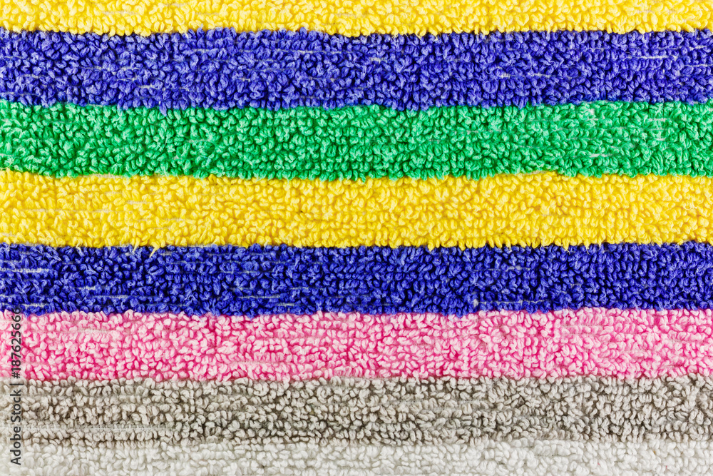 Texture of terry cloth with multi-colored stripes. Natural fabric background Texture of terry cloth with multi-colored stripes. Natural fabric background