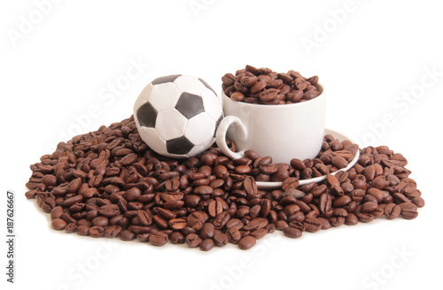 Coffee beans and a white cup on white background