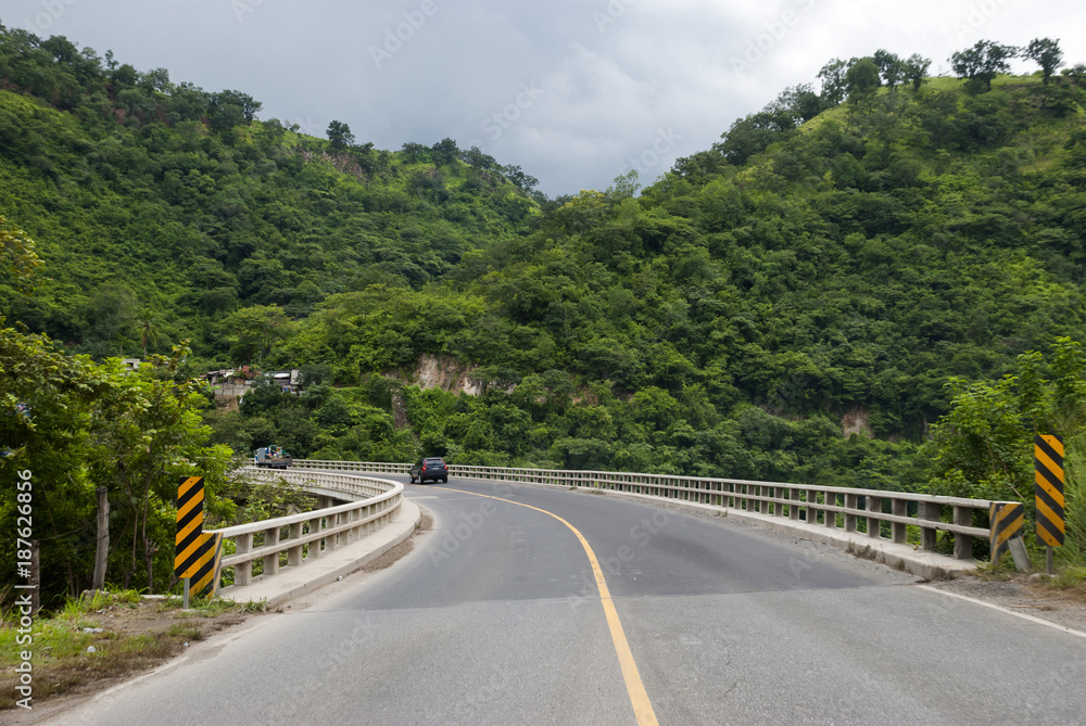 Bridge in Guatemala and green mountains.