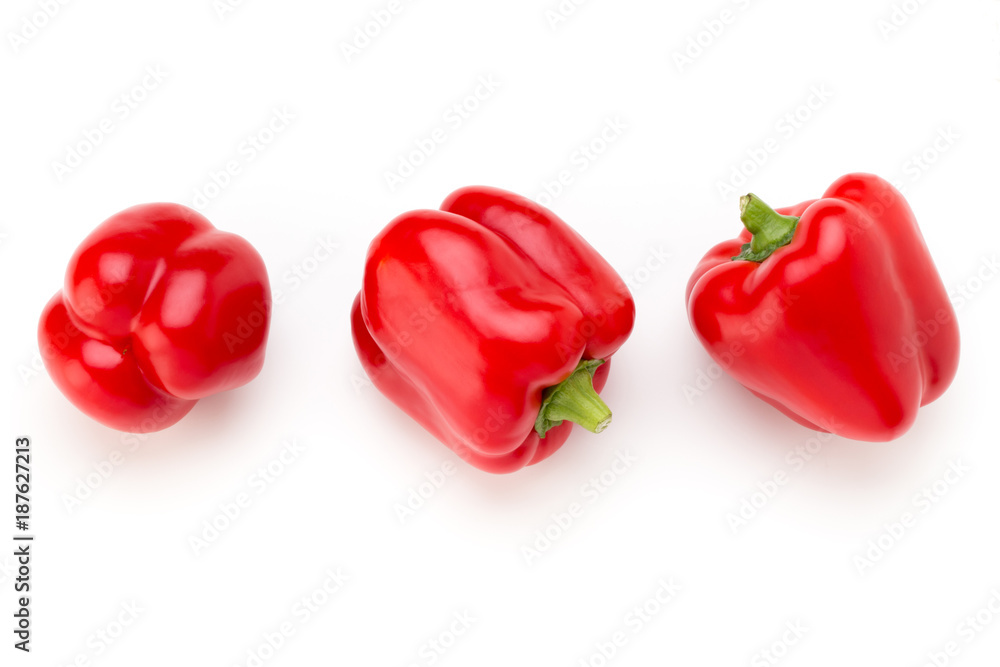 Red bell pepper with half and leaves isolated on white. Red bell pepper with half and leaves isolated on white.