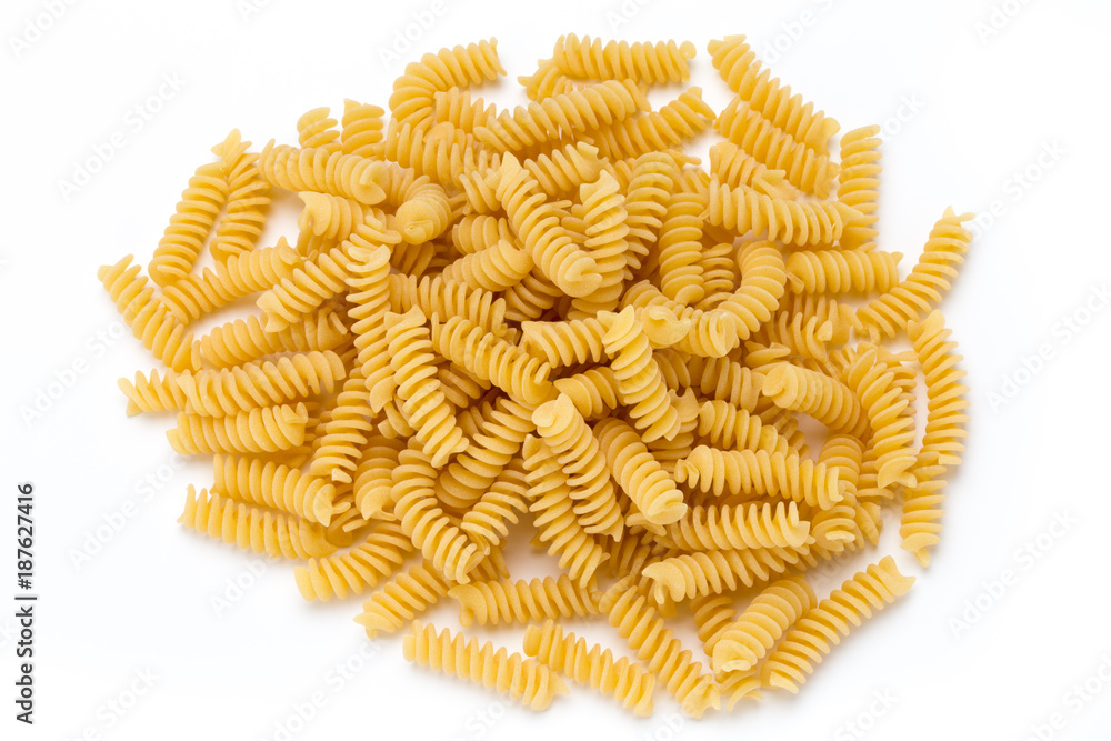 Uncooked fusilli pasta isolated white background. Uncooked fusilli pasta isolated white background.