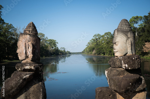 temple statues in front of a river to protect the temple 